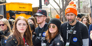 Flanked by her husband,Bart Freundlich and children,Liv and Caleb,while attending the March For Our Lives event in 2018.