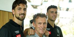 Collingwood’s Josh and Nick Daicos flank their dad – club great,Peter – during grand final week.