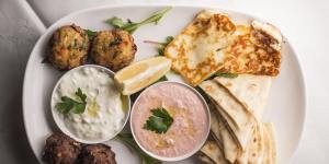 The mezze plate for two includes garlicky tzatziki and salmon-pink taramasalata.