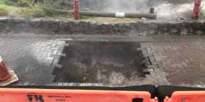 Perth couple injured as steaming sinkhole opens up on New Zealand footpath