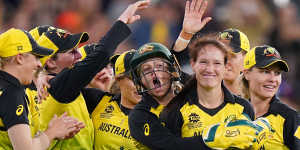 Schutt to thrill:The Australian women's team celebrate after Megan Schutt (second from right) dismissed India's Shikha Pandey in the T20 World Cup final at the MCG.
