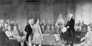 The signing of the Constitution of the United States,which sets out the Electoral College system of voting,in 1787.