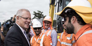 Hammer blows ... Scott Morrison on the campaign trail at the Mulgoa Road Corridor in Penrith on Friday.