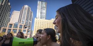 People chant into a megaphone during the Global Climate Strike protest in Vancouver,British Columbia.