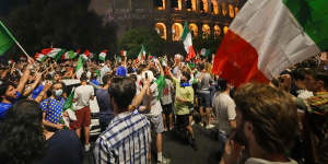 Fans celebrate at the Colosseum in Rome after Italy’s penalty shootout win over England.