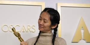 Chloe Zhao,winner of the best director and best picture awards for Nomadland,poses in the press room at the Oscars at Union Station in Los Angeles. 