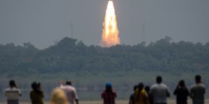 People watch the ISRO rocket lift-off in Sriharikota,India. 