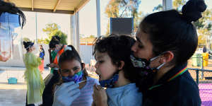 Latisha Carr-McEwan and her children at a Dubbo testing clinic on Monday. 