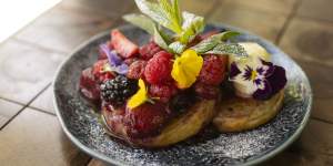 Warm toasted crumpets with berry compote.
