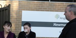 Liz Lane with daughter Samantha and Anthony Bowe outside Newmarch House earlier this week. 