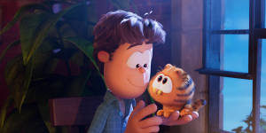John (voiced by Nicholas Hoult) with baby Garfield in The Garfield Movie.