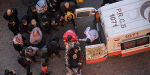 Palestinians injured in an Israeli airstrike arrive at Nasser Medical Hospital in Khan Younis.