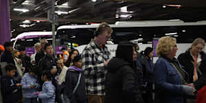 Passengers waiting to board replacement coaches at Southern Cross Station on Thursday morning.