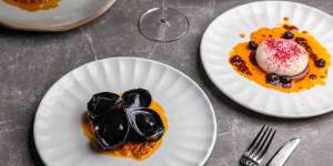 Squid ink tortellini with crab meat,roast tomato and lemon and caper sauce.