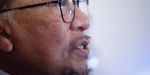 Anwar Ibrahim had to strike a deal with former foe Barisan Nasional to form government.