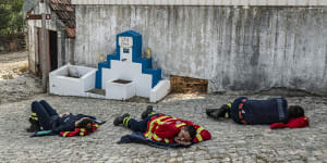 Firefighters are among the many types of essential we rely upon to work at all hours of the day. This photograph shows firefighters resting on the ground after spending the night battling wildfires in Portugal in 2022.
