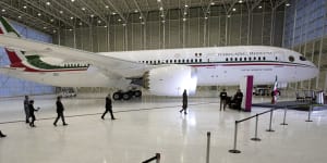 FILE - In this July 27,2020 file photo,Mexican President Andres Manuel Lopez Obrador,center left,waves to the press as he arrives to give his daily,morning press conference in front of the former presidential plane at Benito Juarez International Airport in Mexico City. LÃ³pez Obradorâs quixotic bid to sell off the presidential jet has now stretched into its third year in 2021,with no sign of a buyer in sight. (AP Photo/Marco Ugarte,File) APÂ 