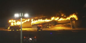 The Japan Airlines Airbus A350 ablaze on the tarmac in Tokyo.