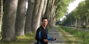 Made for two wheels ... Stuart Wilson takes a breather on a bike path north of Brugge.