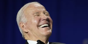 President Joe Biden laughs as comedian Roy Wood jnr speaks during the White House Correspondents’ Association dinner. 