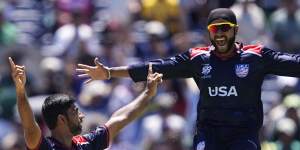 US players Saurabh Nethralvakar,left,and Harmeet Singh celebrate their triumph.