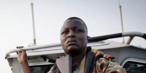 A member of an anti-piracy team from Benin,in West Africa,on patrol in the Bight of Benin in 2011. 