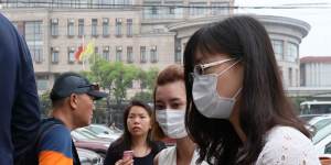 Employees and families of Crown Resort arrive at Baoshan People's Court on Monday morning. 