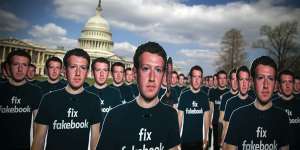 Cutouts of Facebook CEO Mark Zuckerberg are displayed on the South East lawn of the Capitol building ahead of testimony before a joint hearing of the Senate Judiciary and Commerce Committees in Washington,DC.