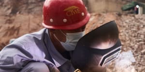 An employee of China Water&Electric Corp welds pipework at the construction site of the Gwayi-Shangani dam,245km north-west of Bulawayo,Zimbabwe,in June.
