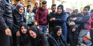 People mourn as they collect the bodies of Palestinians killed in an airstrike on in Khan Yunis,southern Gaza on Wednesday.