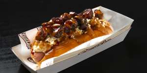 The Mochi hot dog topped with shredded chicken,bacon,plantain and house-made barbecue aioli. 