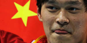 China's Sun Yang wins gold and breaks the world record in the men's 1500m freestyle.