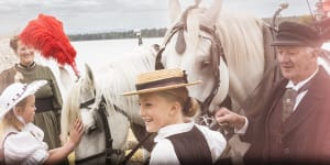 Phoebe,8,and Violette,9,greet horses drawing a traditional carriage with members of the Whittlesea Historical Society and Friends of Toorourrong dressed in traditional 1800s outfits at Yan Yean Reservoir. 