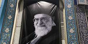 A giant banner of Khamenei stretched over one of the Islamic Cultural Centre’s windows. 