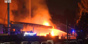 Factory evacuated as more than 100 firefighters battle large fire in south-west Sydney