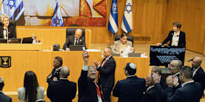 Israeli Minister of National Security,Itamar Ben-Gvir,centre,and lawmakers celebrate after Israel’s parliament passed a law approving the death penalty for Palestinians convicted of murdering Israelis on Momday.
