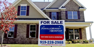A “For Sale” sign sits outside a home in the US.