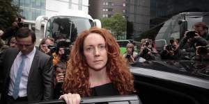 Britain’s phone hacking scandal forced Rupert Murdoch to settle a lawsuit with News investors,close News of the World and sack its editor Rebekah Brooks.