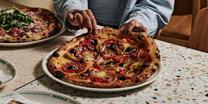 Salami,olive and pickled chilli pizza.
