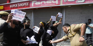 India imposes curfews in Kashmir after clashes during religious procession