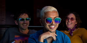 Meg-an Windred and Adrian Murdoch from LGBTQIA+ organisation Minus 18 and activist Dom Thattil (centre). wearing Quay Australia sunglasses from their Pride collection.