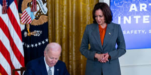 US President Joe Biden,with Vice President Kamala Harris,as he signed the executive order on Monday.