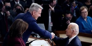 US President Joe Biden arrives and shakes hands with House Speaker Kevin McCarthy during his State of the Union speech in February. Today,the two are at loggerheads over the debt ceiling.