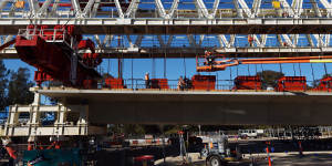A Skytrain span being assembled by one of two massive movable gantries.