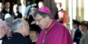 Archbishop George Pell with then prime minister John Howard in 2002. 