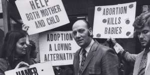 Abortion law reform campaigner Dr Bertram Wainer,surrounded by protesters outside his East Melbourne Fertility Control Clinic in 1976.