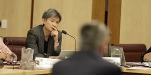 Labor senator Penny Wong listens to Finance Minister Mathias Cormann in a committee hearing on Tuesday morning.