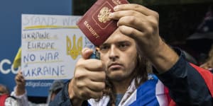 Fomin burns his Russian passport in protest at the invasion of Ukraine.