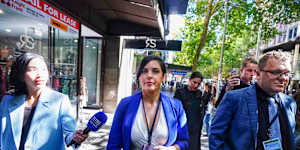Liberal MP Moira Deeming (centre) leaving Liberal Party headquarters on Sunday.
