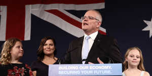 Flanked by his wife and daughters,Scott Morrison declares victory in front of the party faithful on May 18,2019.